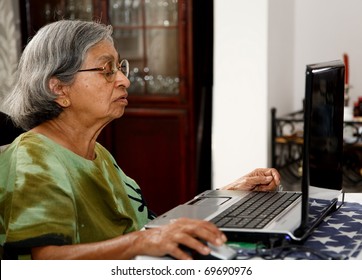 Asian old woman using computer