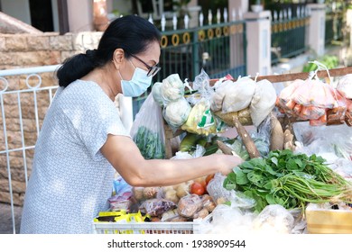 Asian Old Women Shop Cooking Ingredients In Mobile Traditional Seller