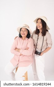 Asian Older Woman And Her Daughter On White Background, Travel Concept 