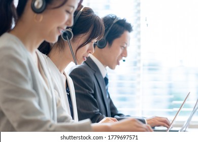 Asian operator working in office