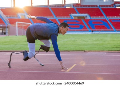 Asian para-athlete with prosthetic blades leg in stadium practicing workout for Paralympic running competition. Amputee sportsman runner practicing running workout. Disabled athlete man sport concept. - Powered by Shutterstock