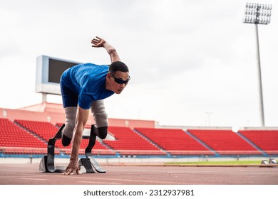 Asian para-athletes disabled with prosthetic blades running at stadium. Attractive amputee male runner exercise and practicing workout for Paralympics competition regardless of physical limitations. - Powered by Shutterstock