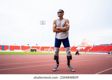 Asian para-athletes disabled with prosthetic blades standing at stadium. Attractive amputee male runner exercise and practicing workout for Paralympics competition regardless of physical limitations. - Powered by Shutterstock