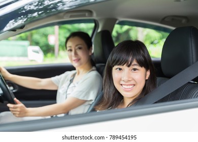  Asian Parent And Daughter In A Car