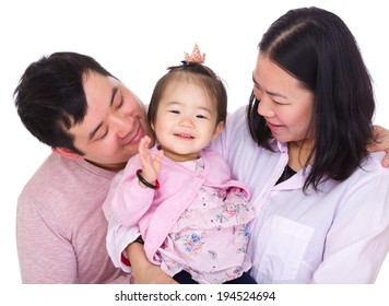 Asian Parent Looking At Baby Daughter