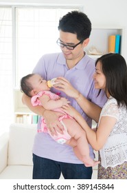 asian parent nursing their baby