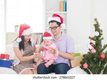 Asian Parents Celebrating Christmas With Baby