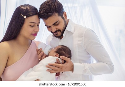 Asian Parents With Newborn Baby, Closeup Portrait Of Asian Young Couple Father Mother Holding New Born Baby In Hospital Bed. Happy Asia Lovely Family, Nursery Breastfeeding Mother’s Day Concept