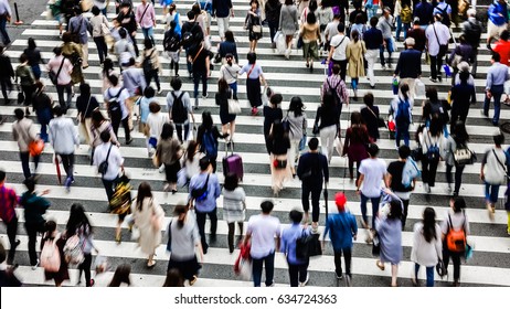 Asian People are across the crosswalk - Shutterstock ID 634724363