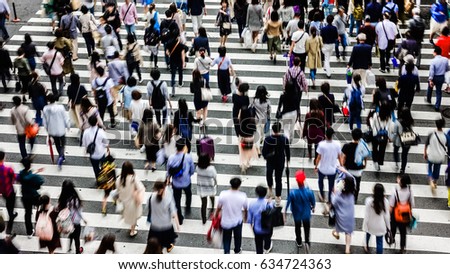 Asian People are across the crosswalk