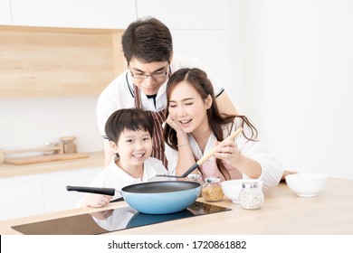 Asian People Family Standing Smile Happy Preparing Cooking Together In Modern Design Kitchen Room With Copy Space, Parent And Kid Is Real People Family.