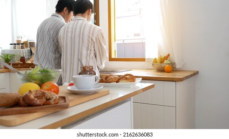 Asian People Happy Time Smile, Laugh In Kitchen. Best Friend LGBTQ Lifestyle. Happy Asian Gay Couple Homosexual Cooking Together In Kitchen Prepare Fresh Vegetable Make Organic Salad Healthy Food.