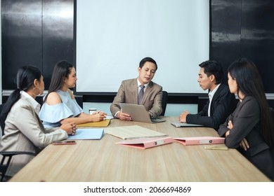 Asian People Leadership Discussion With Team Colleagues In Conference Room During Meeting At Office.