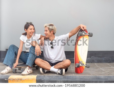Similar – Image, Stock Photo Surfskateboarding in a sitting position