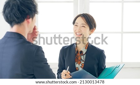Asian people talking in the room. Interview. Consultation.