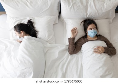 Asian People Wearing Medical Protective Face Masks While Sleeping On The Bed,protect Themselves And Others Or The Family Under The Coronavirus Or COVID-19,stronger Together,new Normal Life Concept