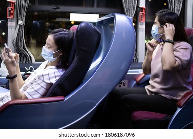 Asian People Wearing Medical Protective Masks While Traveling In Public Transportation,safety In New Normal Conditions Under COVID-19,stronger Together,stop The Infection And Spreading Of Coronavirus