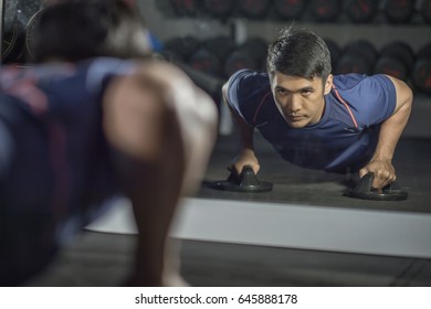 Asian People Work Out By Push Up The Floor In  Modern Gym.