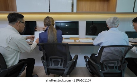 Asian people working together in the office. - Shutterstock ID 2196101157