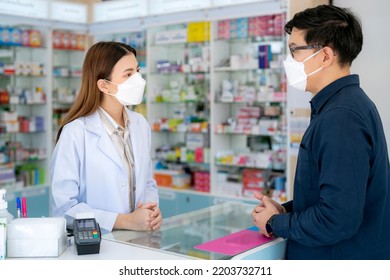 Asian Pharmacist Woman With Protection Mask In Pharmacy Store Of Her Business For Sale A Drug And Pharmacy With Her Customer 