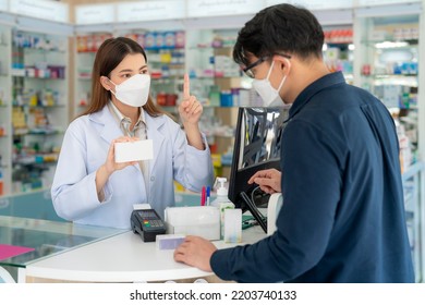 Asian Pharmacist Woman With Protection Mask In Pharmacy Store Of Her Business For Sale A Drug And Pharmacy With Her Customer