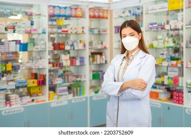 Asian Pharmacist Woman With Protection Mask In Pharmacy Store Of Her Business For Sale A Drug And Pharmacy With Her Customer