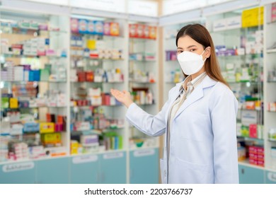 Asian Pharmacist Woman With Protection Mask In Pharmacy Store Of Her Business For Sale A Drug And Pharmacy With Her Customer