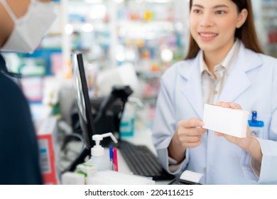 Asian Pharmacist Woman With Protection Mask In Pharmacy Store Of Her Business For Sale A Drug And Pharmacy With Her Customer