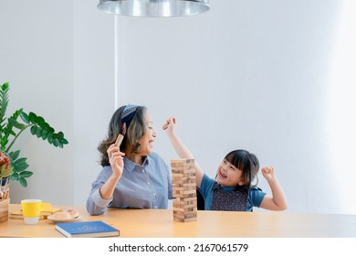 Asian Portrait, Grandchild Granddaughter Grandma Grandmother And Granddaughter Happily Join In Activities To Block Wood Game Puzzle And Enhance Skills For Grandchildren