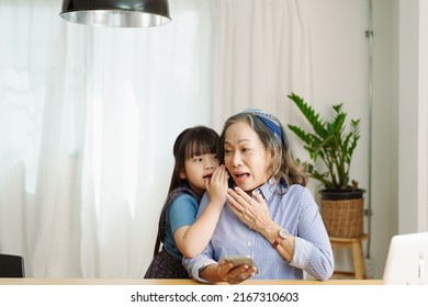 Asian Portrait, Grandmother And Granddaughter Doing Leisure With Little Children Whispering Secrets Between Each Other