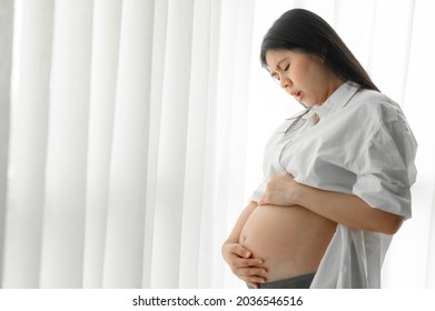 Asian Pregnant Woman Touch Her Tummy Feeling Hurt And Stomachache 