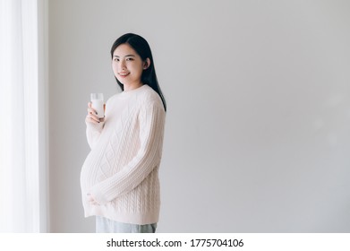 Asian Pregnant Women Drinking Milk