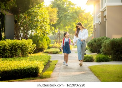 Asian Preschool Girl Walk With Her Mother To Go To School With Gardent In Morning Time Background