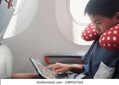 Asian Preteen Boy Travel With Neck Pillow, Using Tablet Inside Airplane, Tween Travel, Family Traveling Abroad With Children