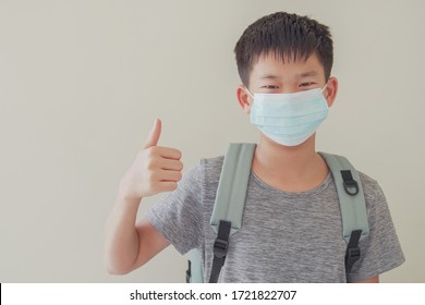 Asian Preteen Tween Teen Boy Student Wearing Mask And Giving Thumb Up, School Reopening, Ready To Return Back To School, Child Vaccine, New Normal Concept