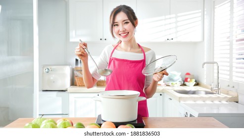 Asian Pretty Housewife Cook Healthy Meal At Home And Smile