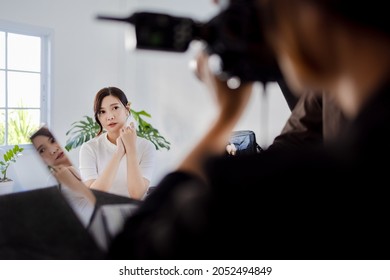 Asian Pretty Model , Photographer And Stylish Shooting Product Fashion Set Together In Studio Setup.