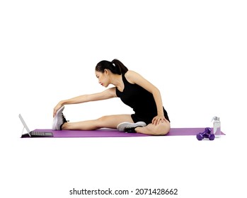 Asian Pretty Sporty Woman In Black Sportwear Leg And Arm Stretching On The Purple Yoga Mat On The White Background.