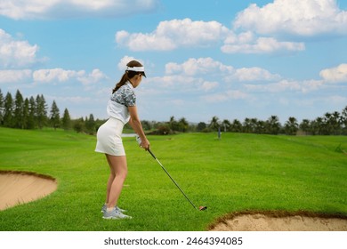 Asian professional golfer play a golf game on tee off in green grass golf course with Fuji mt, sport, travel and relax in vacation time in Tokyo, Japan - Powered by Shutterstock