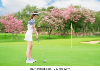 Asian professional golfer play a golf game on tee off in green grass golf course with Fuji mt, sport, travel and relax in vacation time in Tokyo, Japan - Powered by Shutterstock