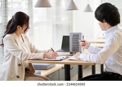 Asian Real Estate Agent Having A Meeting For Real Estate Development