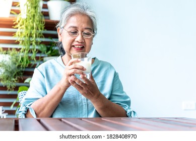 Asian retirement women are drinking milk for good health, To people and health concept. - Shutterstock ID 1828408970