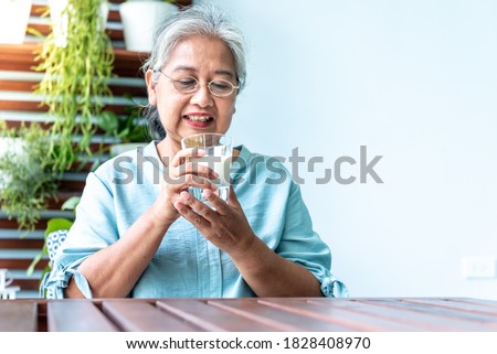Asian retirement women are drinking milk for good health, To people and health concept.