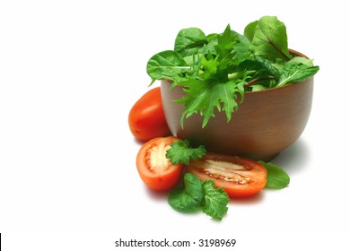 Asian Salad Greens (baby Leaves) In Timber Bowl, Cut And Whole Roma Tomatoes, Isolated On White