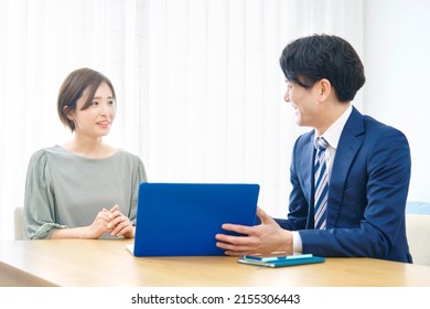 Asian salesperson talking the client  - Shutterstock ID 2155306443