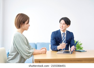 Asian Salesperson Talking The Client 