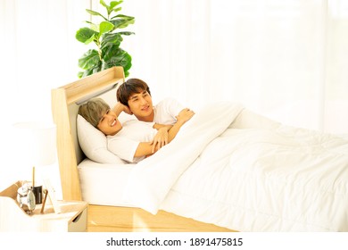 Asian Same Sex LGBTQ Couple Lovers Lying On The Bed Together