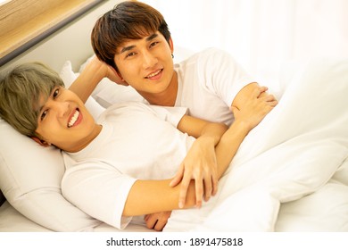 Asian Same Sex LGBTQ Couple Lovers Lying On The Bed Together