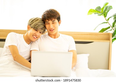 Asian Same Sex LGBTQ Couple Lovers Lying On The Bed Together