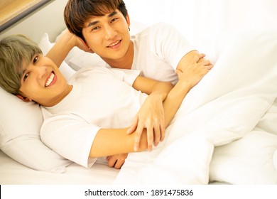 Asian Same Sex LGBTQ Couple Lovers Lying On The Bed Together